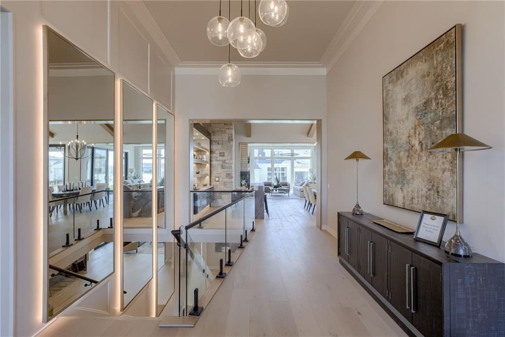 Hardwood floors, staircase and glass stair railing at 13610 Granada Drive, Leawood, KS 66224