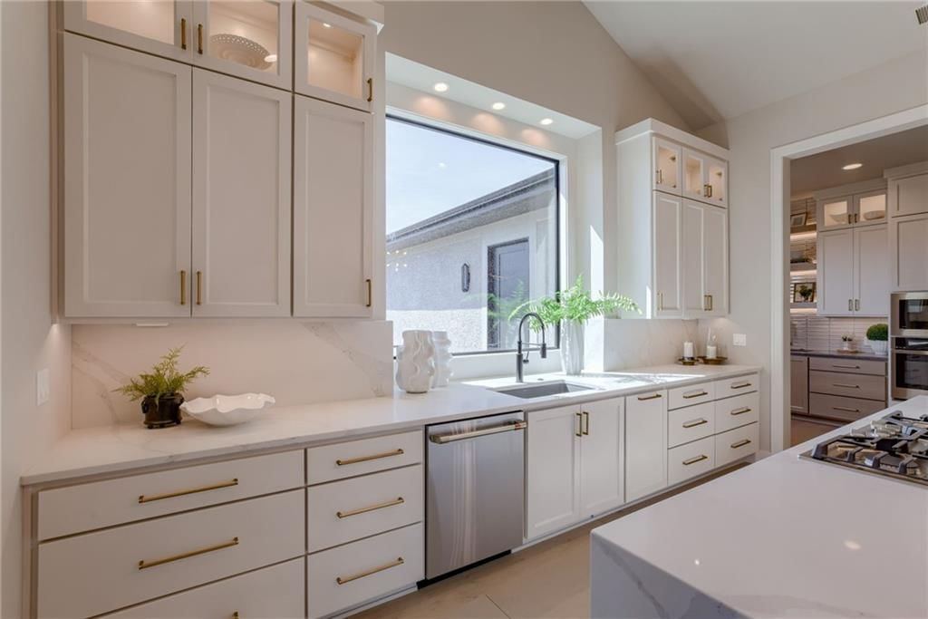 Stainless steel appliances, kitchen backsplash and subway tile backsplash at 13610 Granada Drive, Leawood, KS 66224