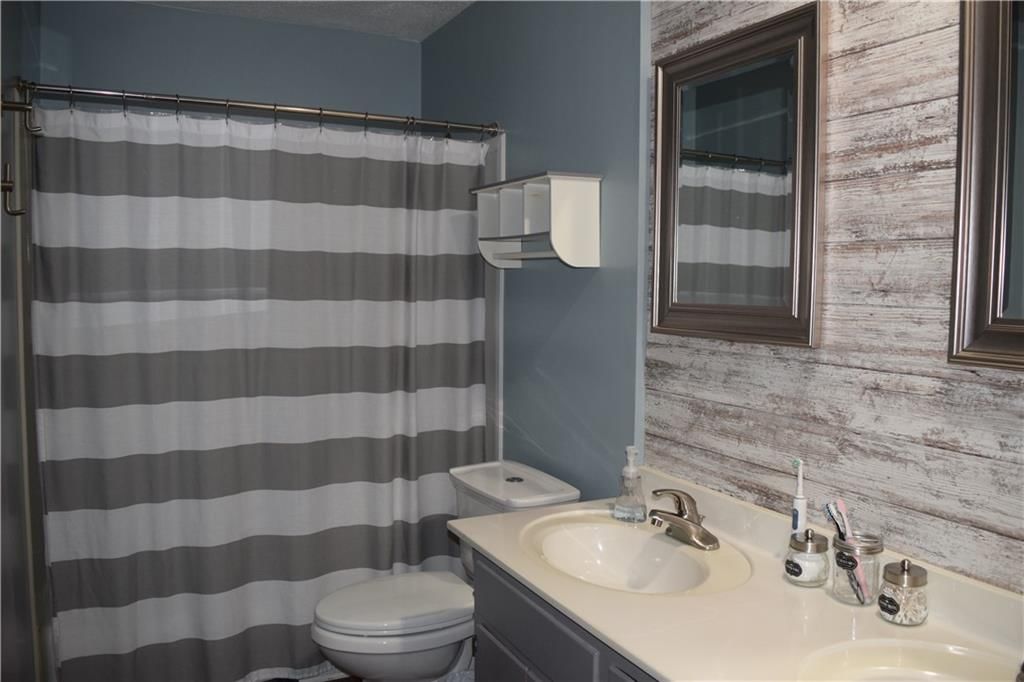 7724 NW Milrey Drive — photo 17