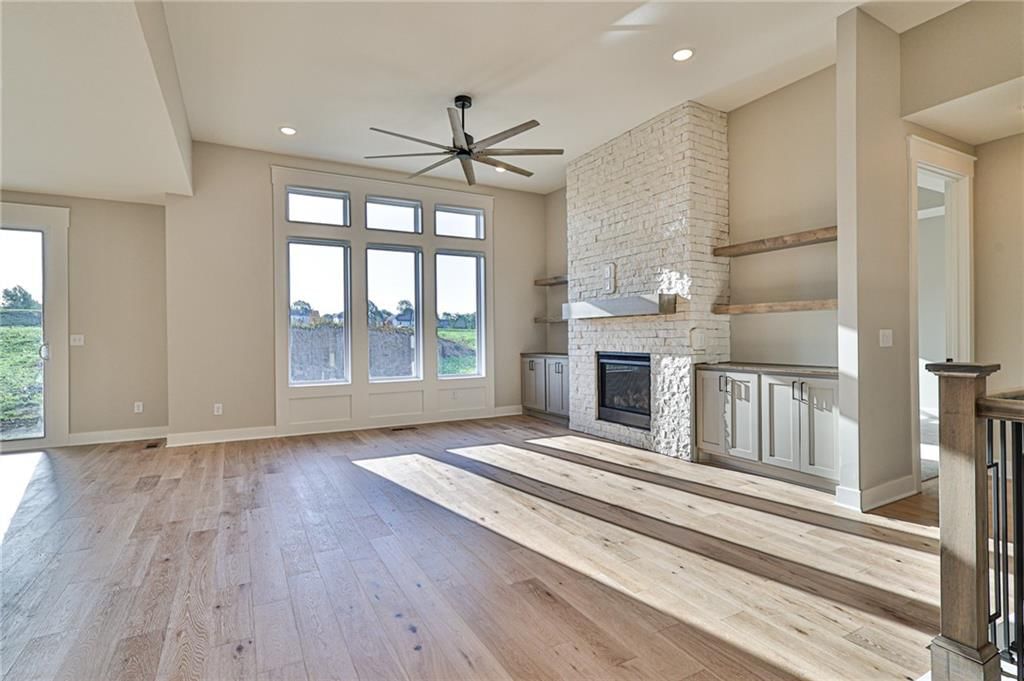 Tall ceilings, fireplace and stone fireplace at 14014 Crawford Creek Circle, Lake Lotawana, MO 64034