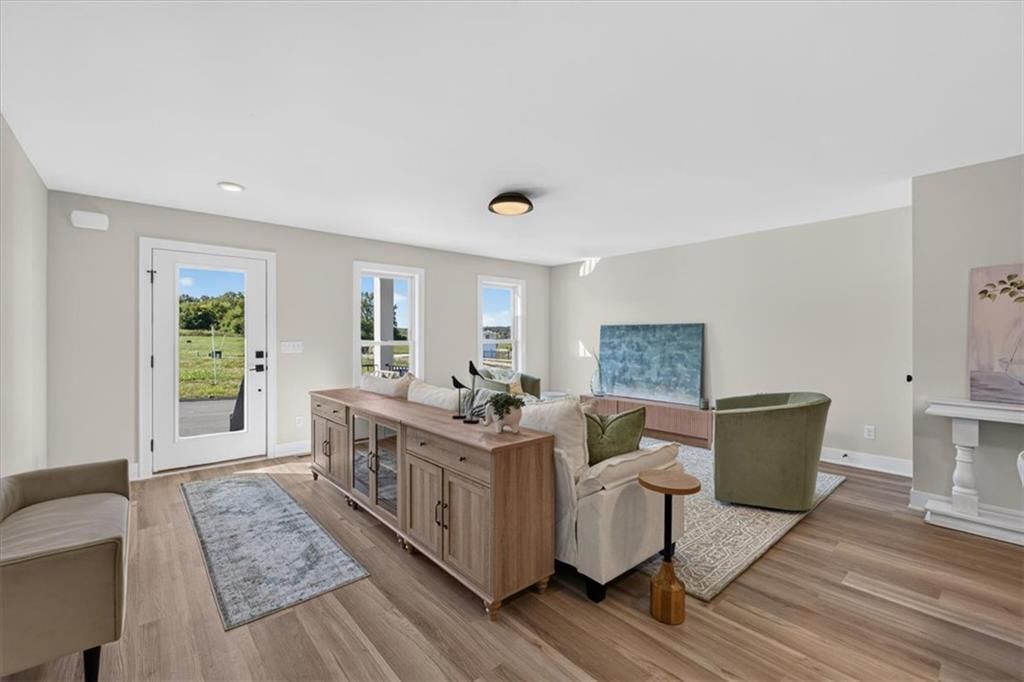 Luxury vinyl floors, black hardware and white trim at 23706 E 11th Street S, Blue Springs, MO 64056