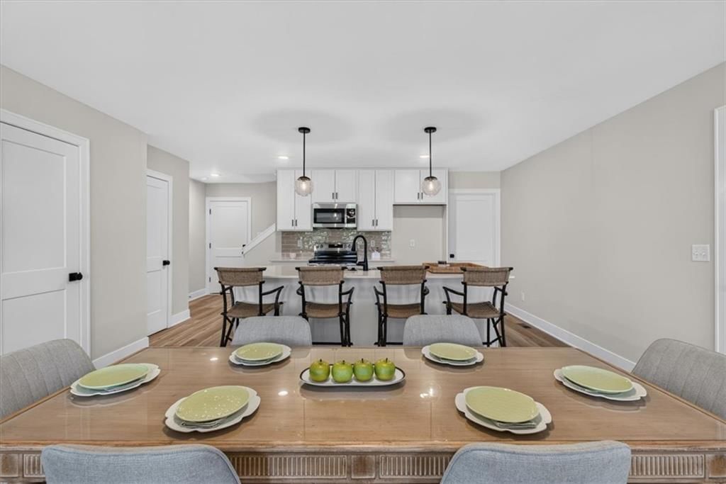 Stainless steel appliances, electric range and kitchen backsplash at 23706 E 11th Street S, Blue Springs, MO 64056