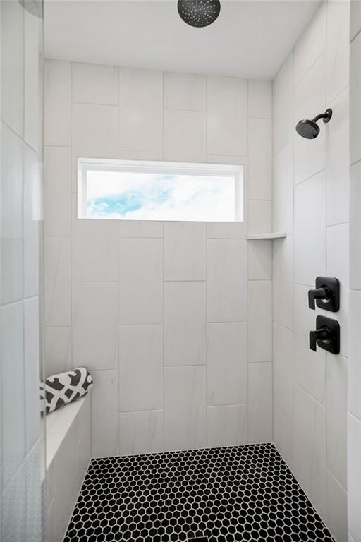 Walk-in shower, tiled shower and frameless glass shower at 4464 Tee Box Drive, Basehor, KS 66007