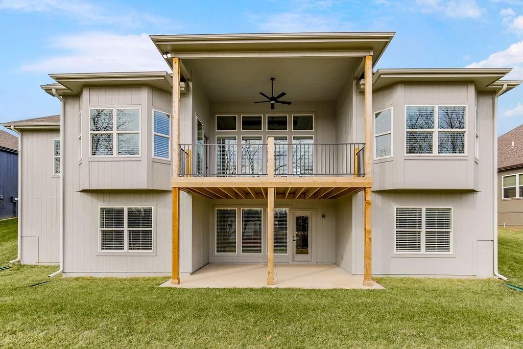 Deck, big backyard and mature trees at 4464 Tee Box Drive, Basehor, KS 66007