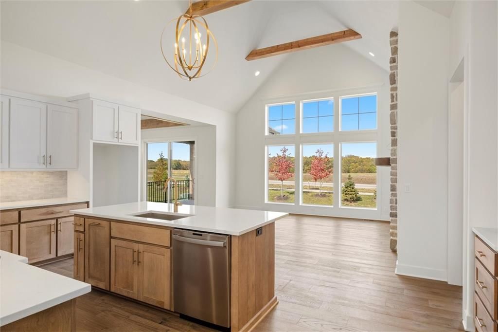 Tall ceilings, open floor plan and floor-to-ceiling windows at 17028 Rosehill Street, Overland Park, KS 66221