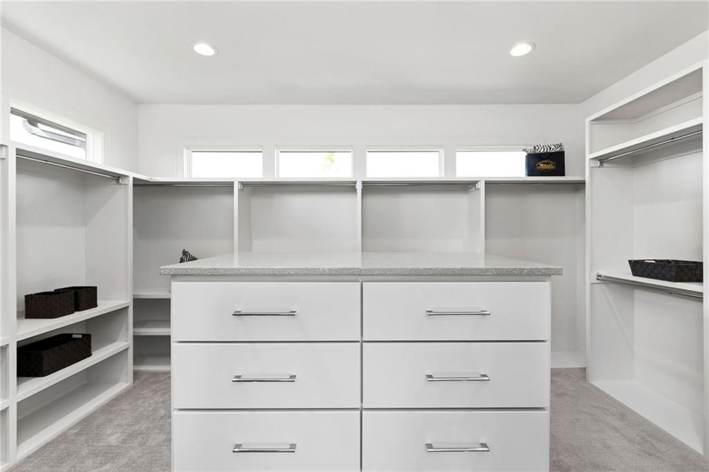 Walk-in closet at 13701 Guilford Road, Leawood, KS 66224