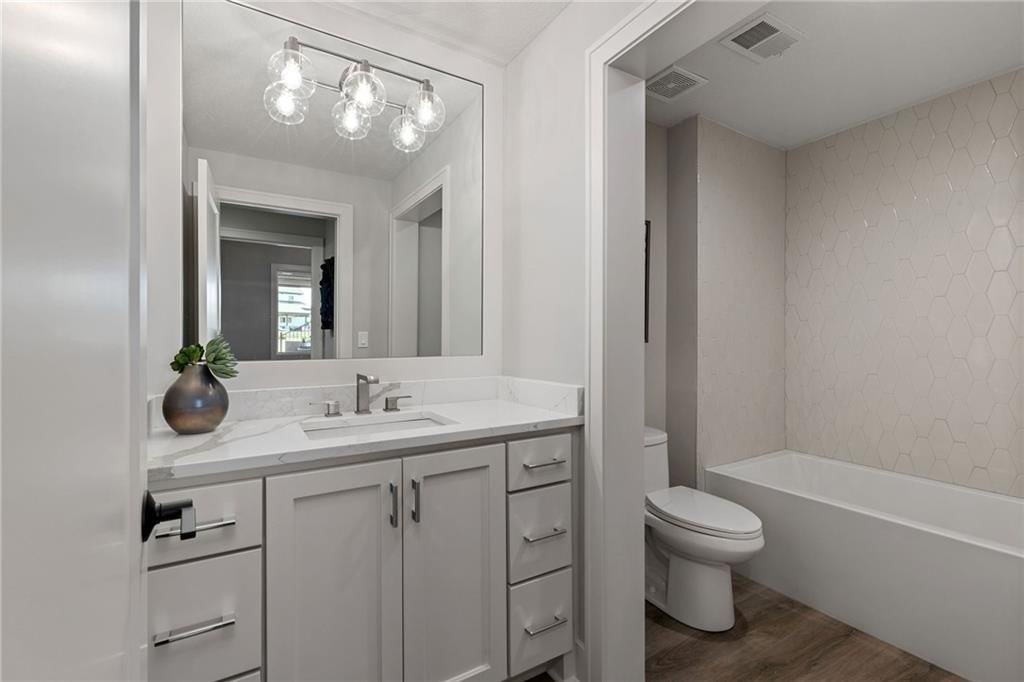 Tub and shower combo at 13701 Guilford Road, Leawood, KS 66224