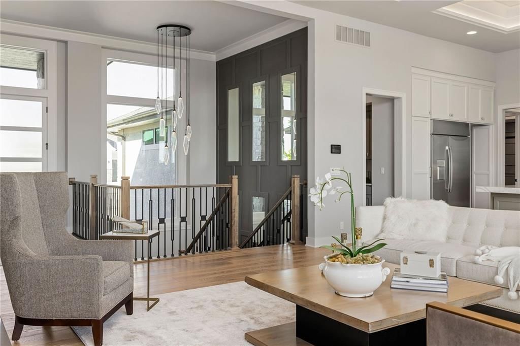 Statement lighting, recessed lighting and white trim at 13701 Guilford Road, Leawood, KS 66224