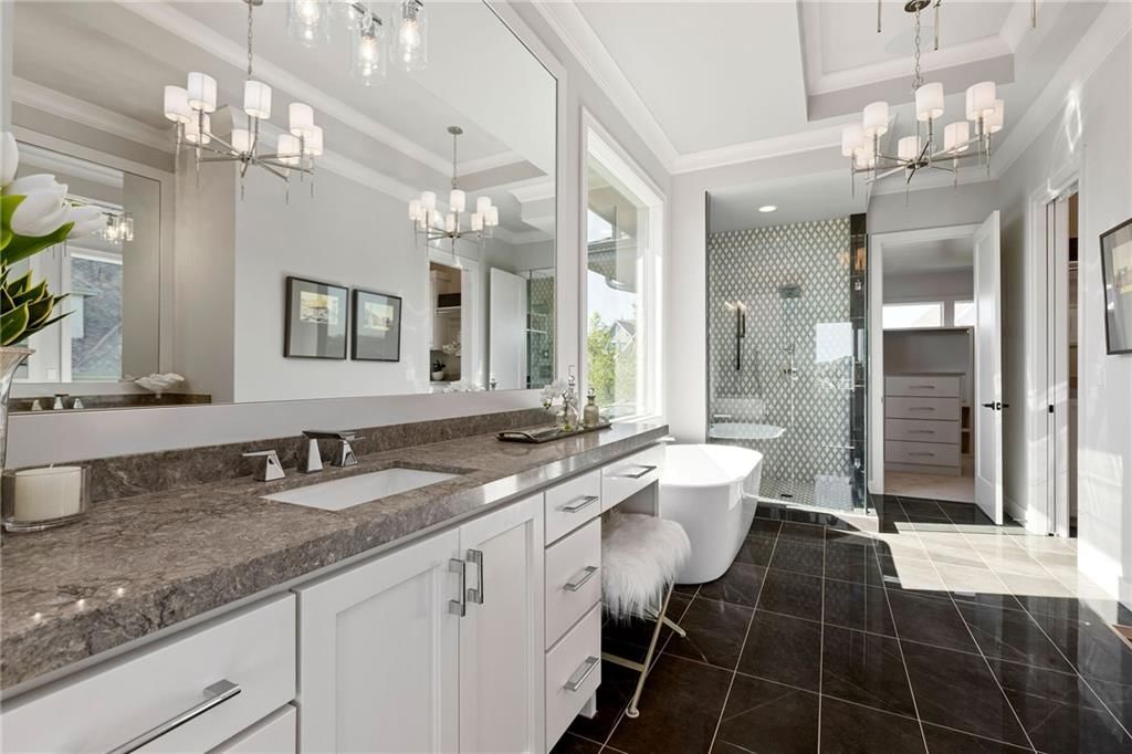 Tile floors, tiled shower and double vanity at 13701 Guilford Road, Leawood, KS 66224