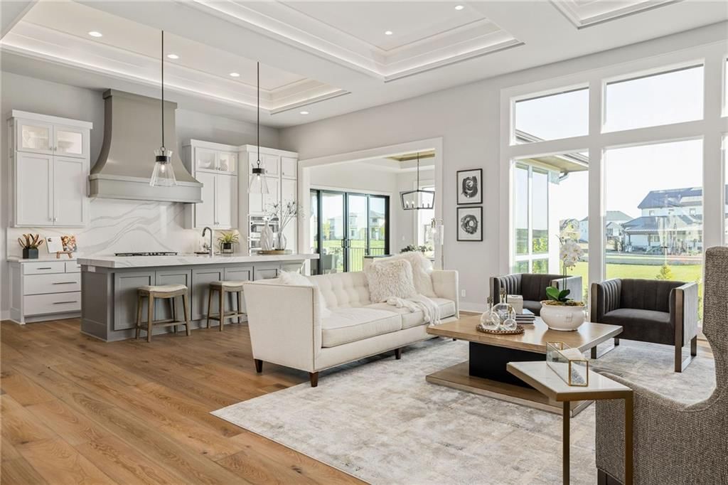 Open floor plan, coffered ceiling and black window frames at 13701 Guilford Road, Leawood, KS 66224