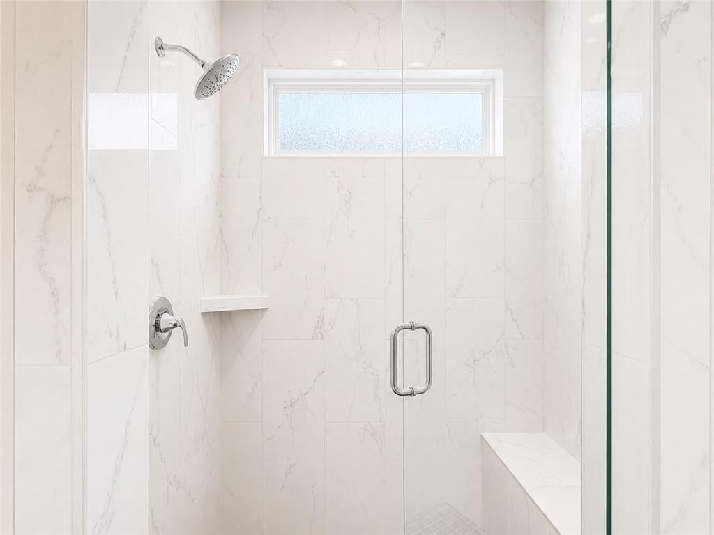 Walk-in shower, tiled shower and frameless glass shower at 8004 Round Prairie Street, Shawnee, KS 66220