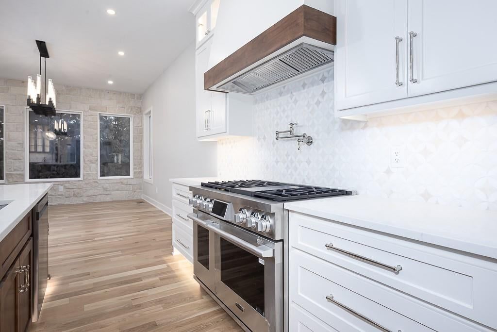 Gas range, pot filler and stainless steel appliances at 18005 235th Street, Tonganoxie, KS 66086