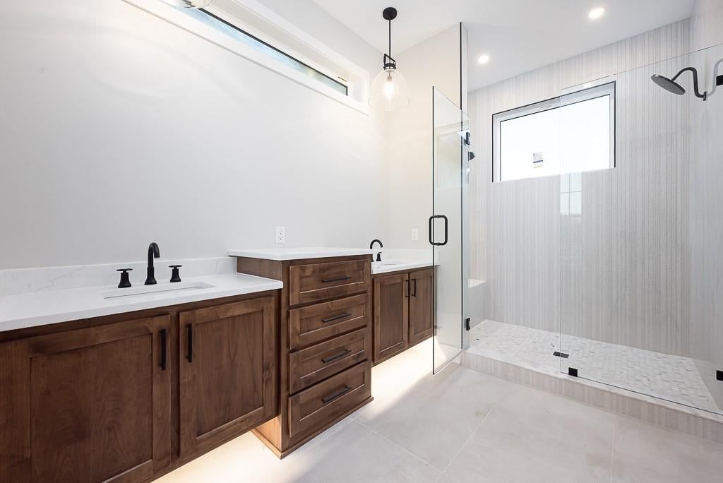 Main-floor primary bedroom, walk-in shower and tiled shower at 18005 235th Street, Tonganoxie, KS 66086