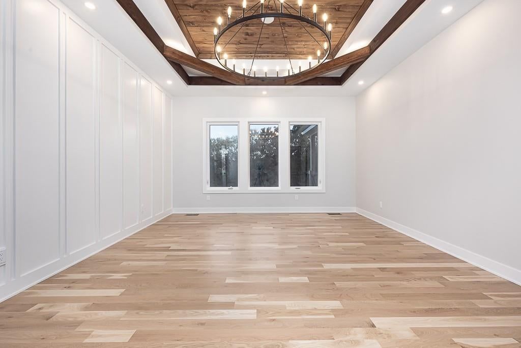 Wainscoting or board and batten, shiplap / paneling and tray ceiling at 18005 235th Street, Tonganoxie, KS 66086