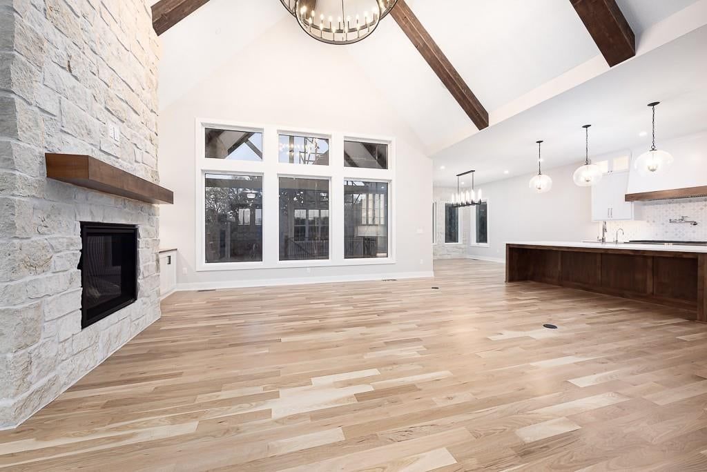 Open floor plan, wall of windows and recessed lighting at 18005 235th Street, Tonganoxie, KS 66086