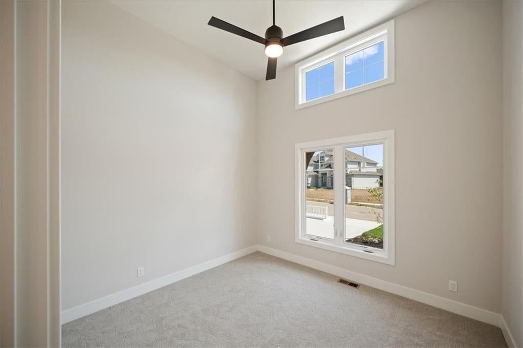 Carpet and main-floor primary bedroom at 2622 SW Barley Field Drive, Lee's Summit, MO 64082