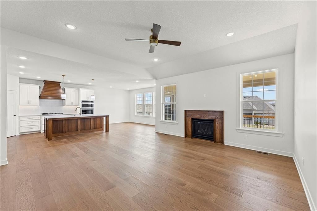 Tall ceilings, open floor plan and kitchen island at 4467 Tee Box Drive, Basehor, KS 66007