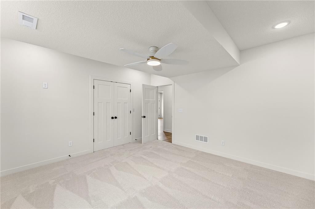 Deck, big backyard and fenced yard at 4467 Tee Box Drive, Basehor, KS 66007