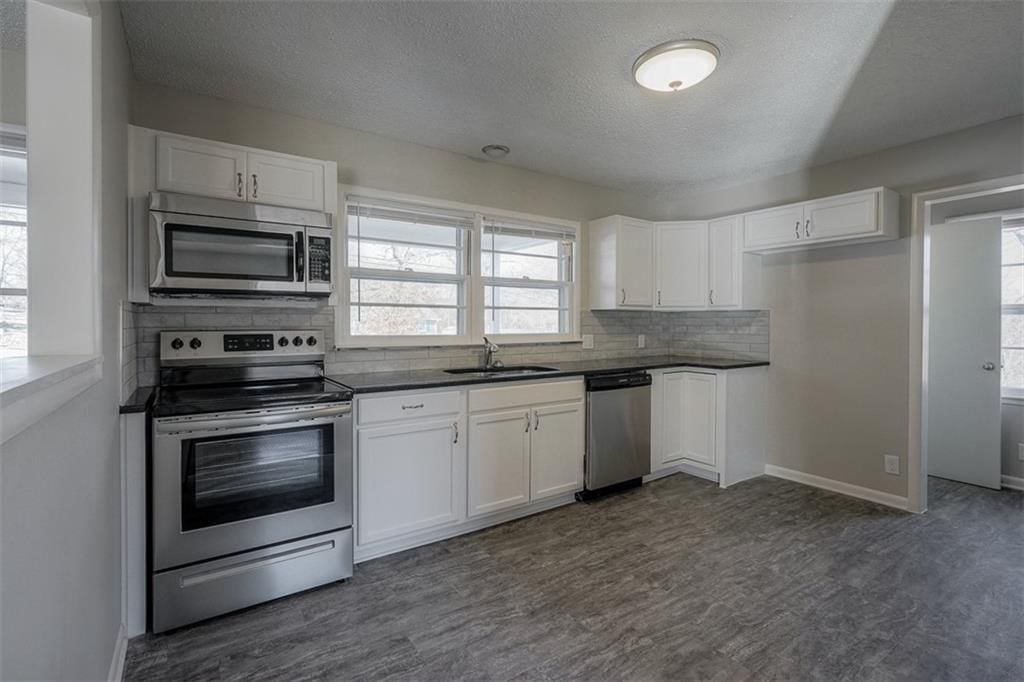 7857 James A Reed Road — photo 8