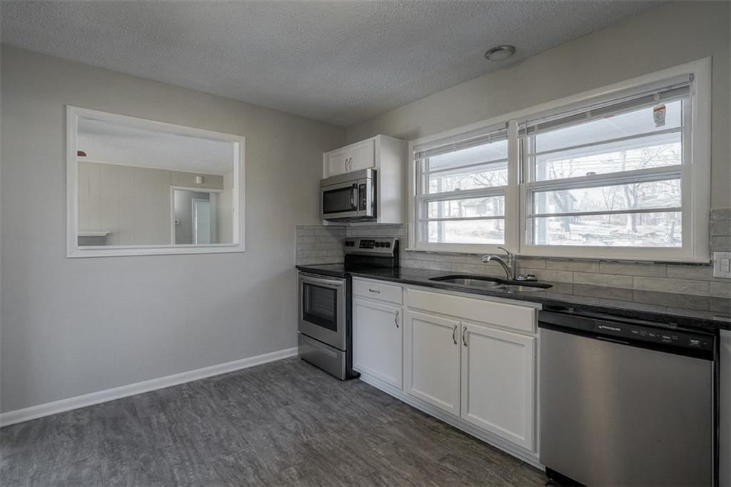 7857 James A Reed Road — photo 10