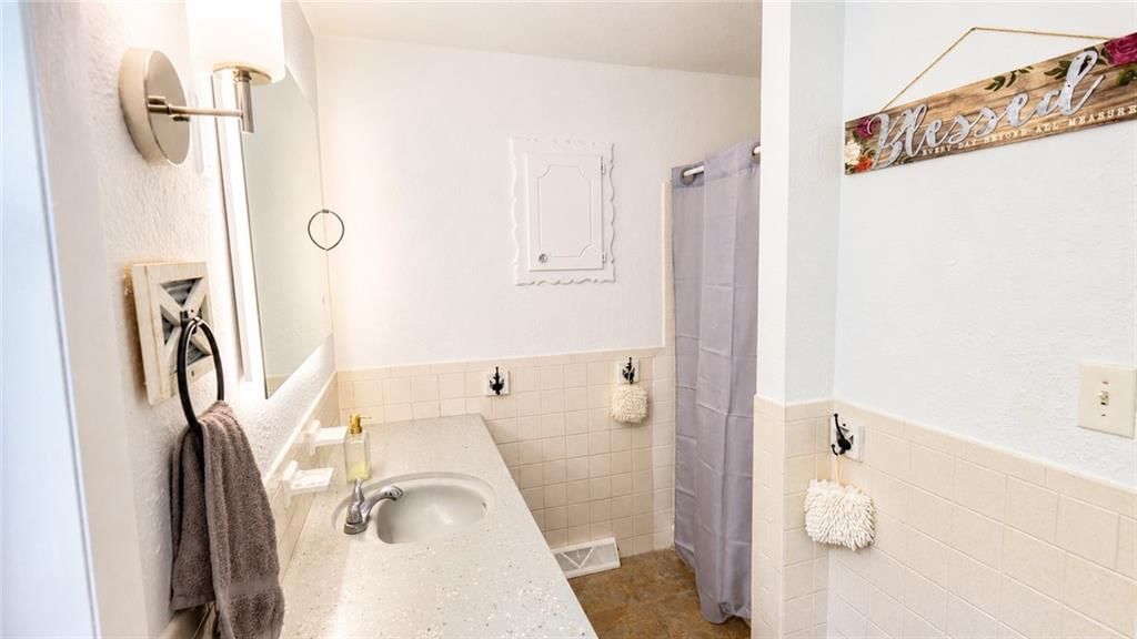 6607 NW QUAIL RUN Drive — photo 16