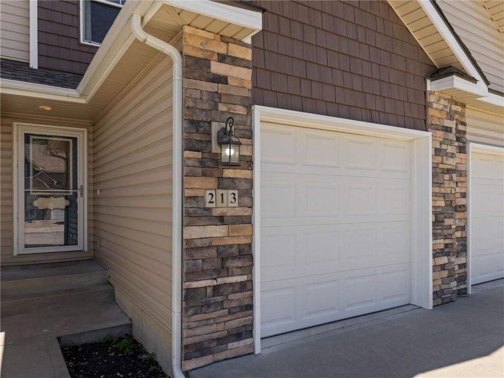 Covered front porch at 213 Pointe Lane, Raymore, MO 64083