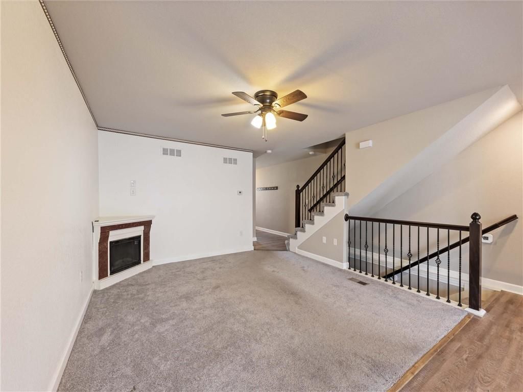 Modern, open floor plan and tall ceilings at 213 Pointe Lane, Raymore, MO 64083
