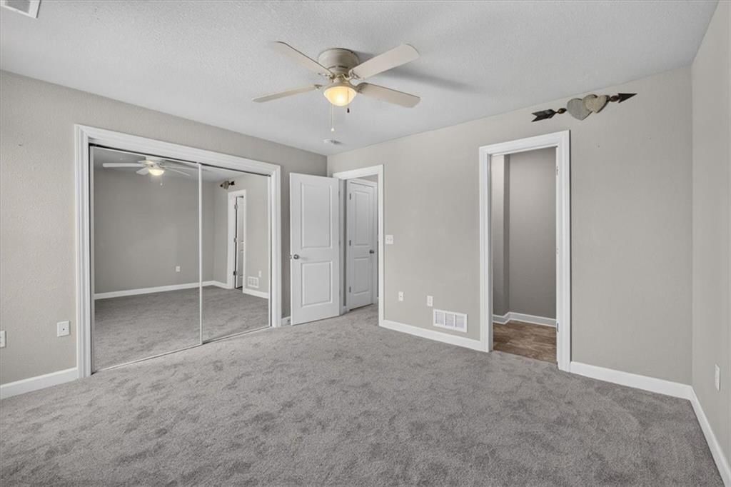 Big backyard and flat lot at 213 Pointe Lane, Raymore, MO 64083