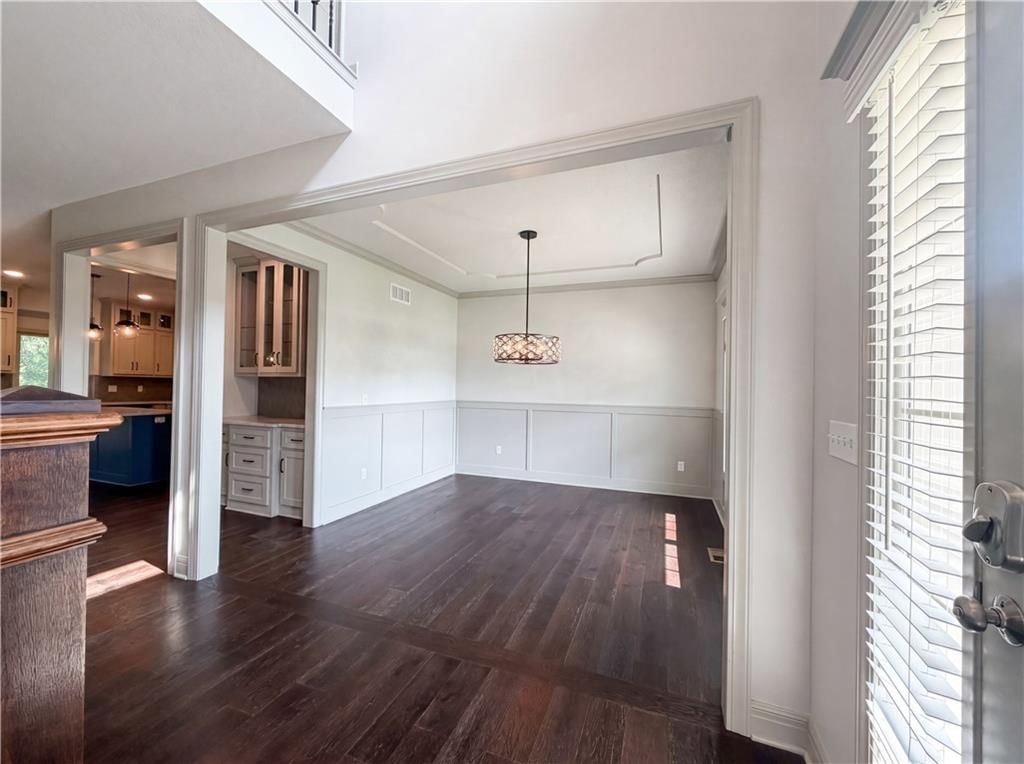 Tall ceilings, shiplap / paneling and wainscoting or board and batten at 7540 N Amity Avenue, Kansas City, MO 64152