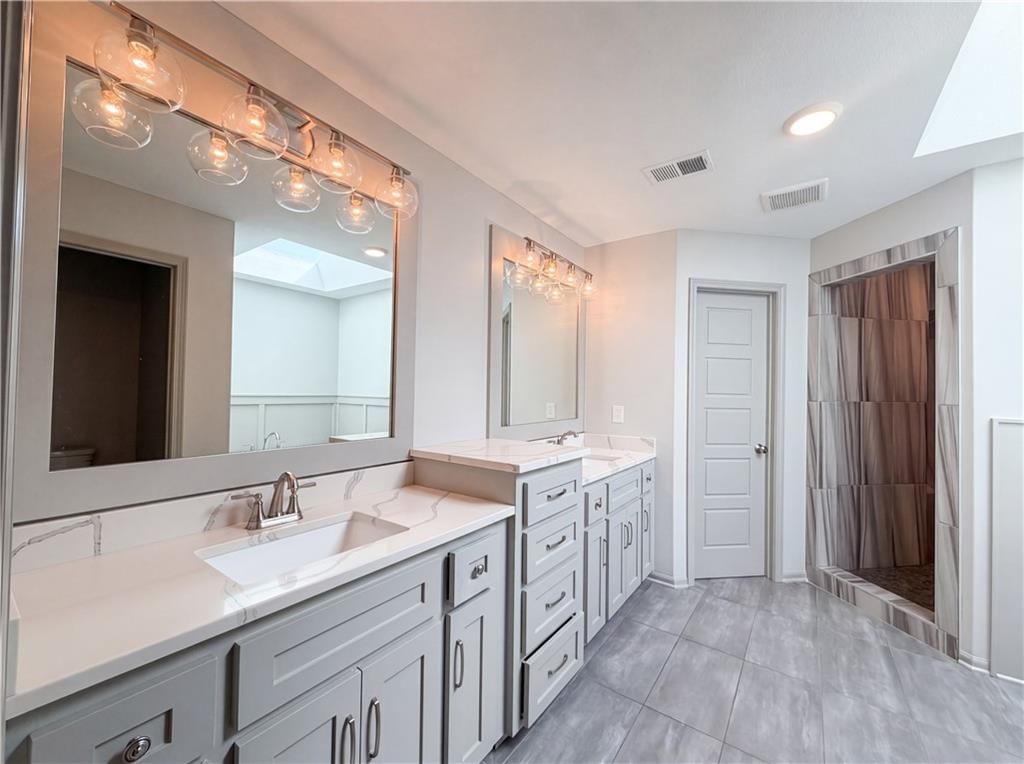 Frameless glass shower, tiled shower and walk-in shower at 7540 N Amity Avenue, Kansas City, MO 64152