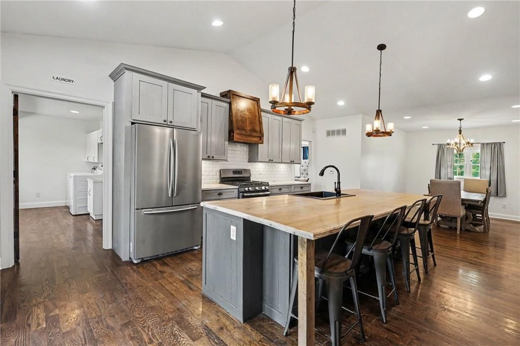 Open floor plan, kitchen island and quartz counters at 3322 N 67th Street, Kansas City, KS 66104