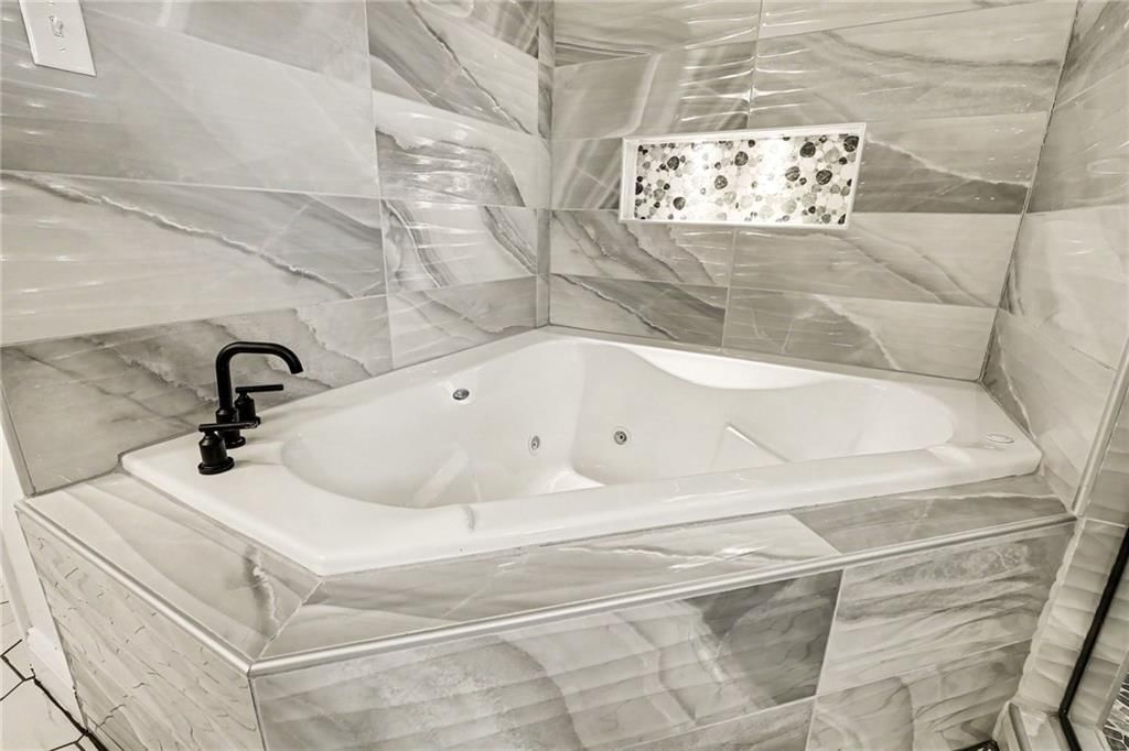 Walk-in shower, tiled shower and frameless glass shower at 3322 N 67th Street, Kansas City, KS 66104