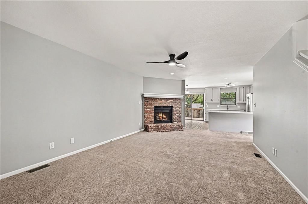 Open floor plan, black hardware and white trim at 7033 N Fisk Court, Kansas City, MO 64151