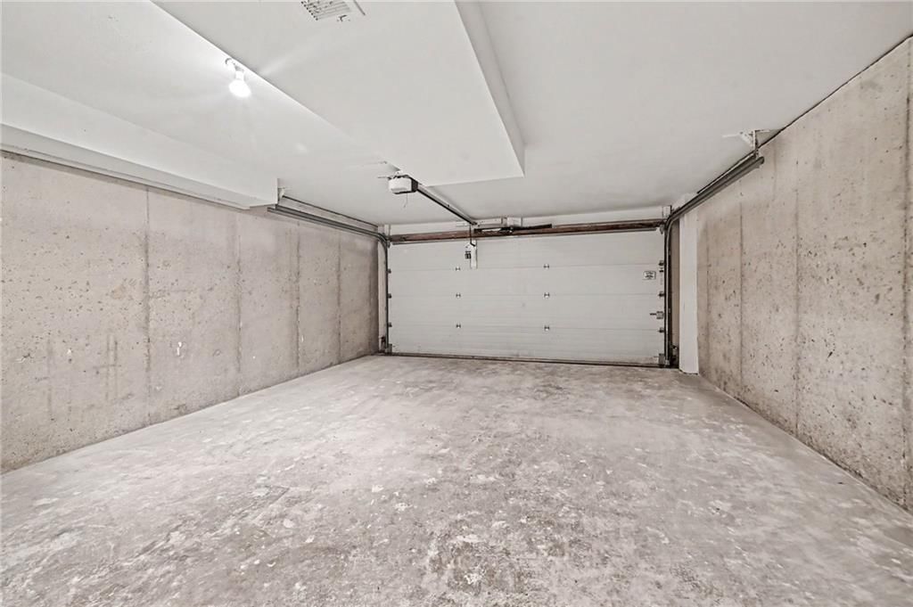 Attached garage at 7033 N Fisk Court, Kansas City, MO 64151