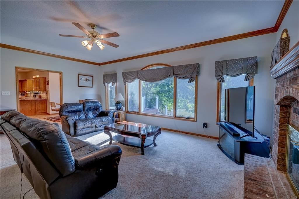 Open floor plan, floor-to-ceiling windows and tall ceilings at 512 Canterbury Lane, Lee's Summit, MO 64063
