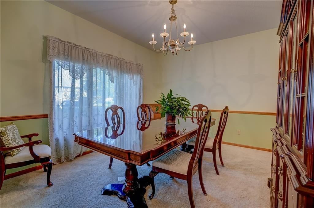 Accent wall, statement lighting and wainscoting or board and batten at 512 Canterbury Lane, Lee's Summit, MO 64063