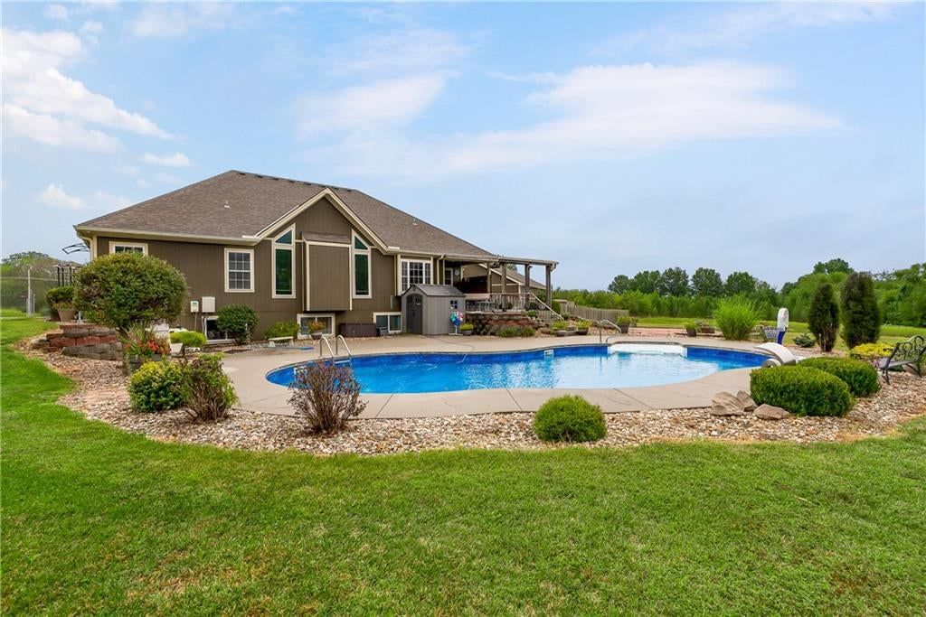 In-ground pool at 7514 S Buckner Tarsney Road, Grain Valley, MO 64029