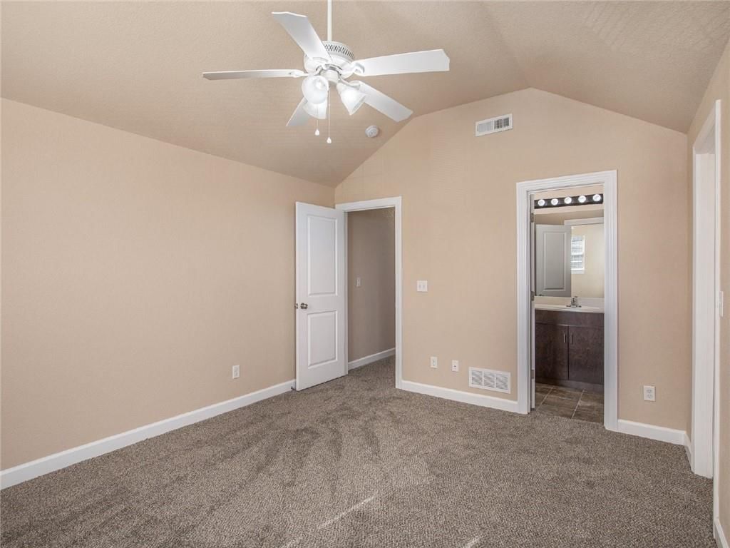 Bonus room and carpet at 254 Pointe Lane, Raymore, MO 64083
