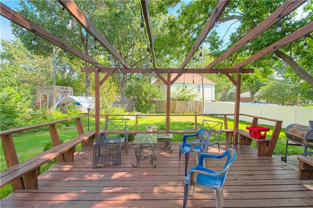 Mature trees, covered patio and deck at 9803 Colony Place, Kansas City, MO 64131