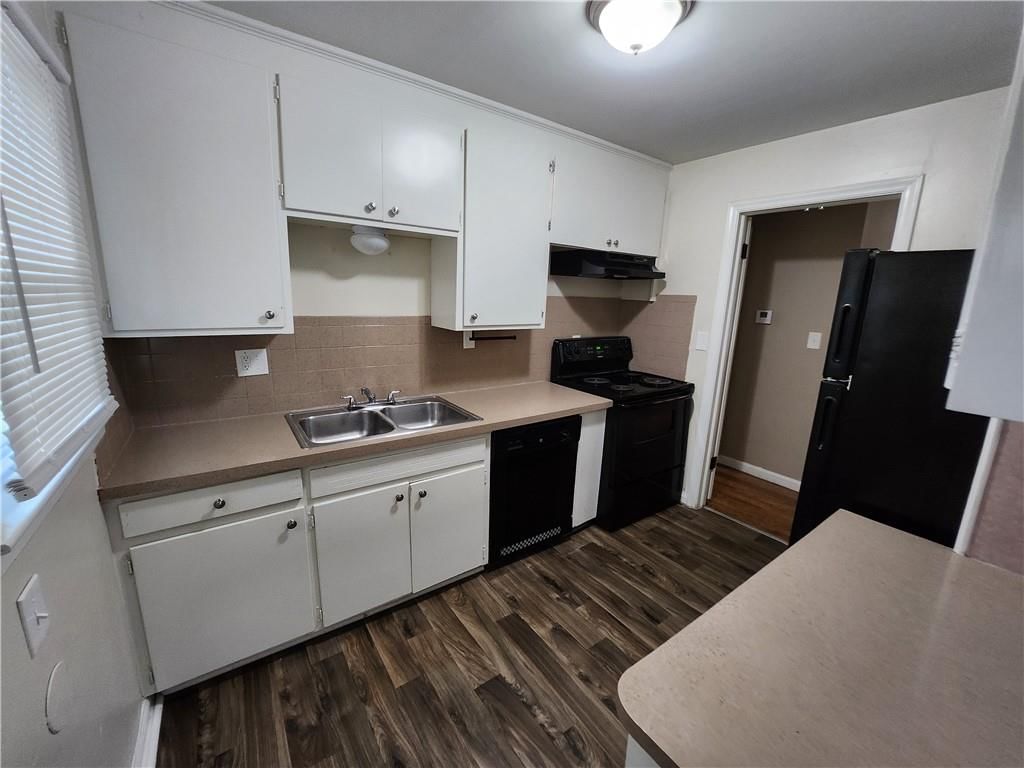 White kitchen, open floor plan and kitchen island at 6601 E 96TH Street, Kansas City, MO 64134