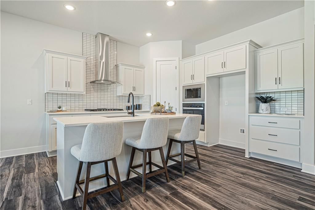Photo 13 of 29 - 1817 Woodward Circle, Raymore, MO 64083
