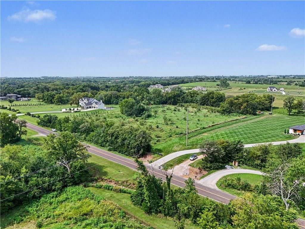 Big backyard, mature trees and flat lot at 20136 Antioch Road, Bucyrus, KS 66013