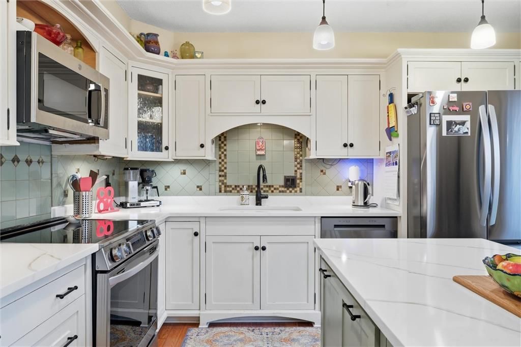 White kitchen, black hardware and updated kitchen at 9573 Outlook Drive, Overland Park, KS 66207