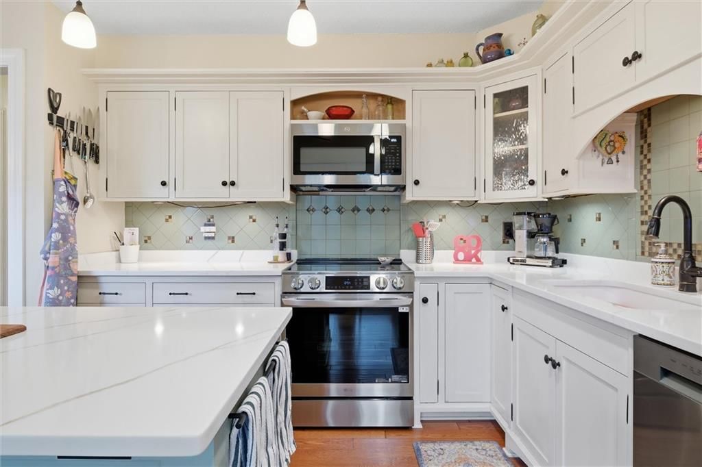 Statement lighting, double oven and breakfast nook at 9573 Outlook Drive, Overland Park, KS 66207