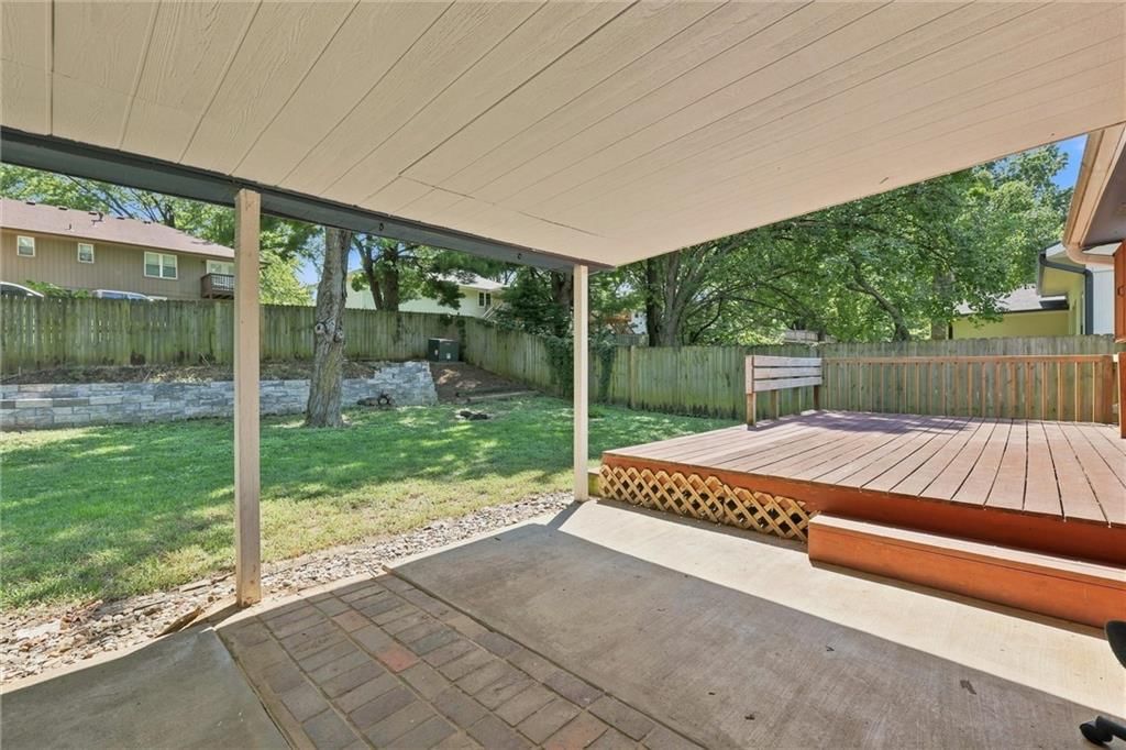 Deck, covered patio and concrete patio at 5519 NW Verlin Drive, Kansas City, MO 64152