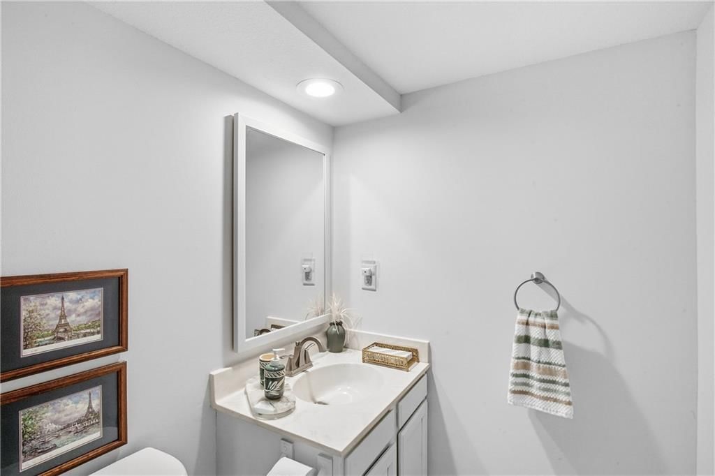 Ceiling beams, statement lighting and wainscoting or board and batten at 7426 Santa Fe Drive, Overland Park, KS 66204