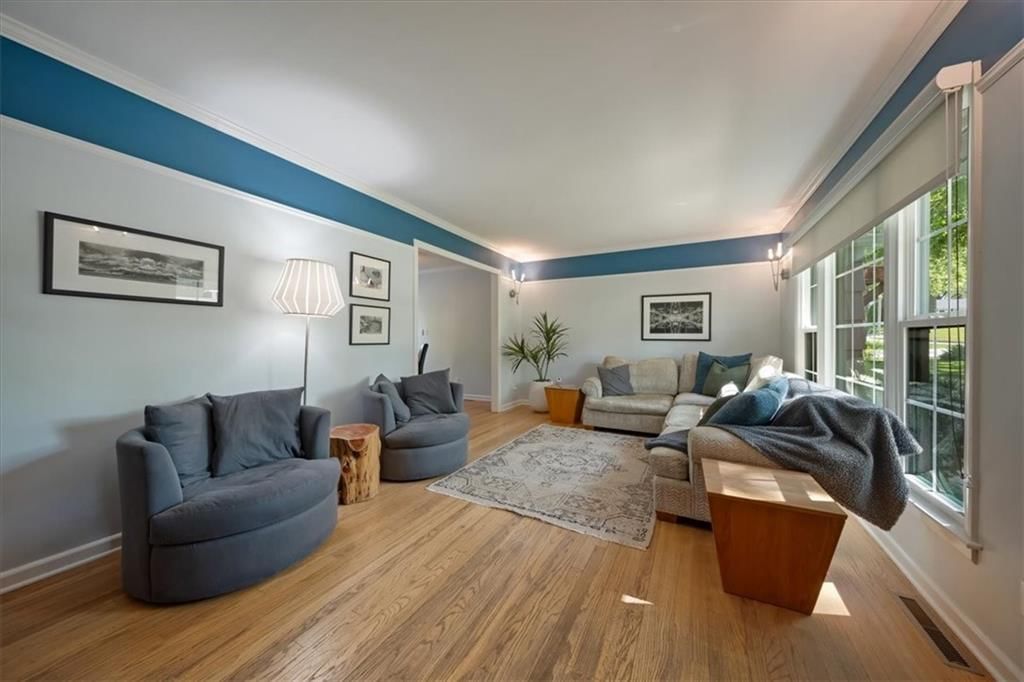 Open floor plan, hardwood floors and white trim at 9119 Washington Street, Kansas City, MO 64114