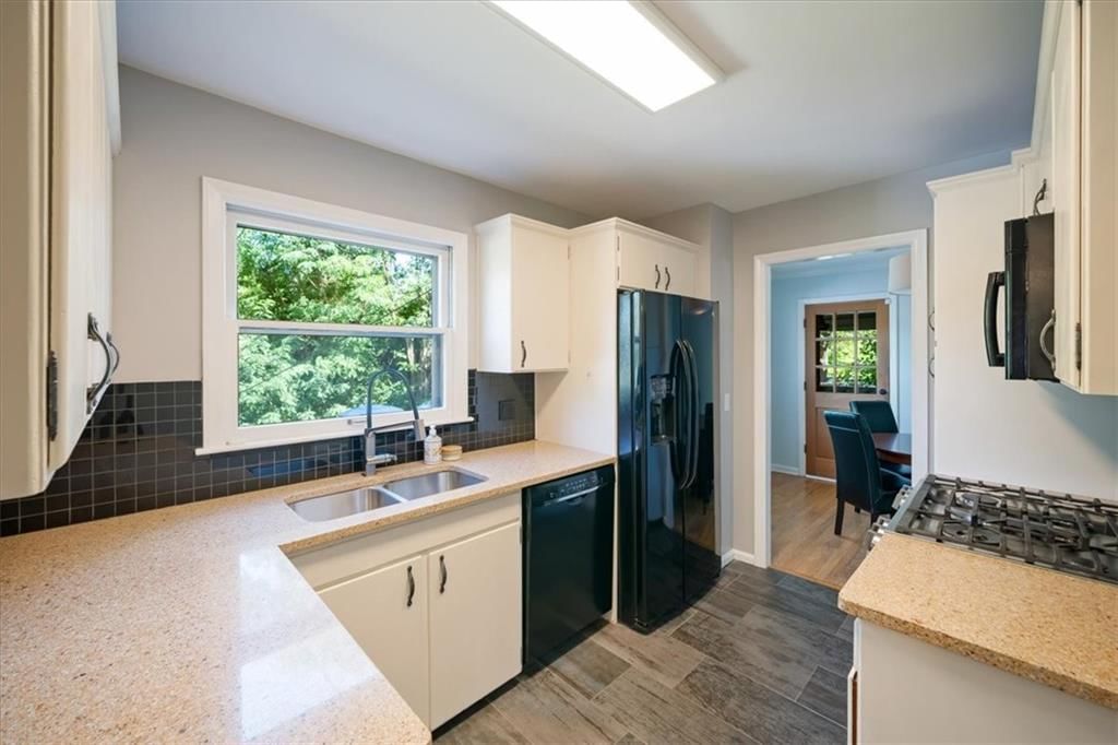Black hardware, updated kitchen and quartz counters at 9119 Washington Street, Kansas City, MO 64114