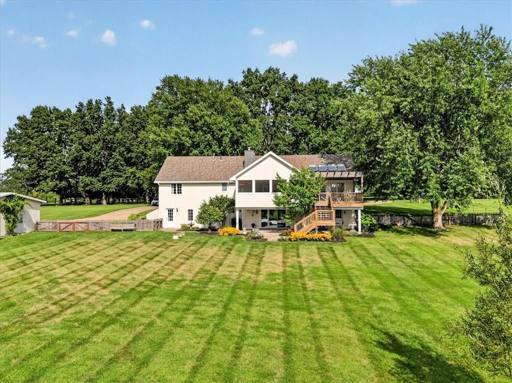 In-ground pool at 3216 S Bellechase Drive, Grain Valley, MO 64029