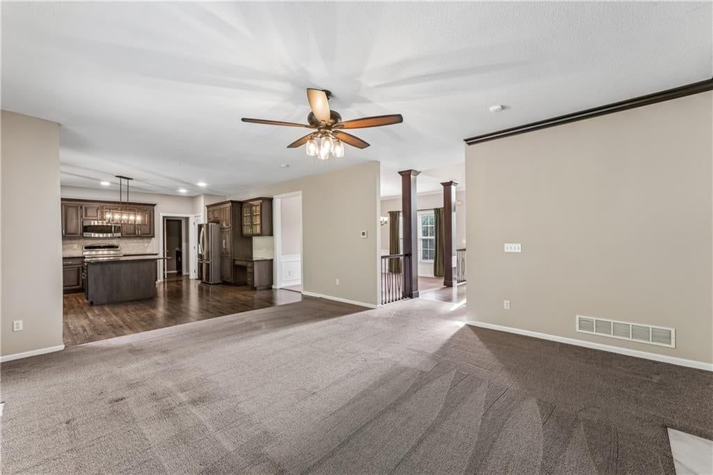 Open floor plan, hardwood floors and wall of windows at 12178 S PRAIRIE CREEK Parkway, Olathe, KS 66062